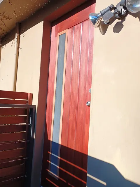 Refurbished timber entry door with a fresh finish