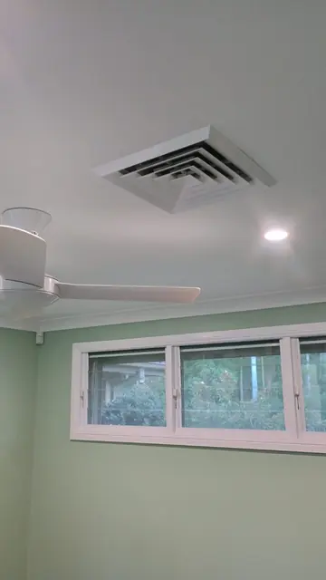 Room with freshly painted green walls, white ceiling and window